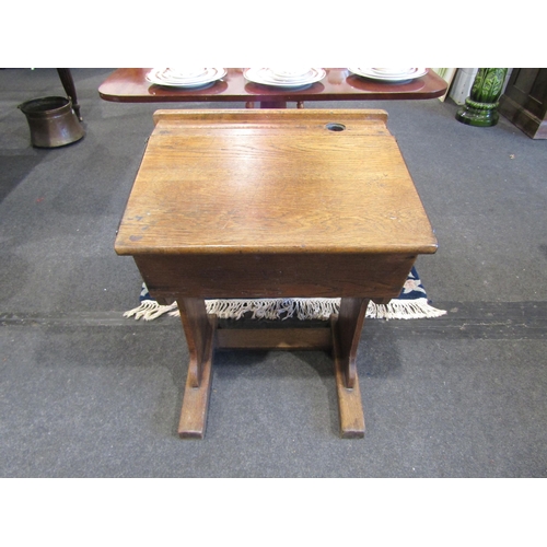 1110 - A late 19th/early 20th Century oak students desk, 80cm tall x 55cm wide x 46cm deep