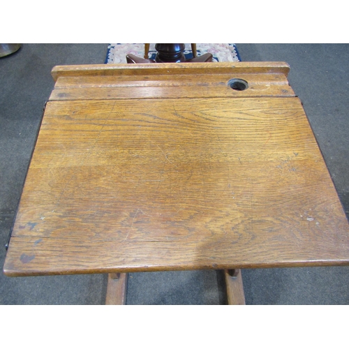 1110 - A late 19th/early 20th Century oak students desk, 80cm tall x 55cm wide x 46cm deep