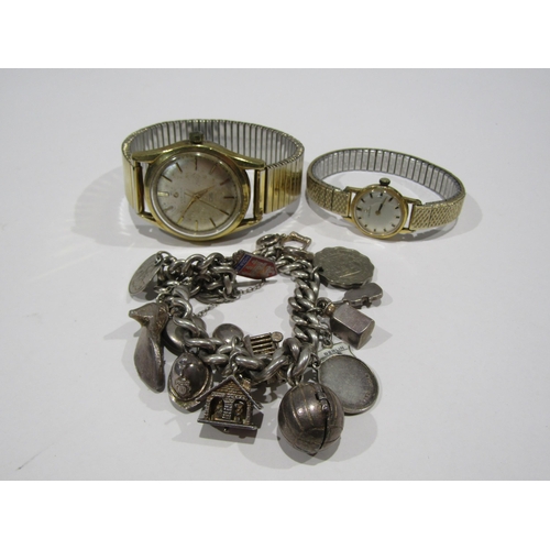 1236 - A tin of bijouterie to include a silver charm bracelet