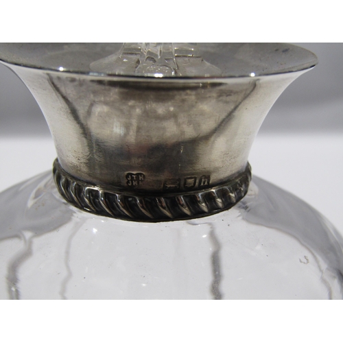 1254 - A glass brandy decanter with silver collar, 17cm tall with stopper