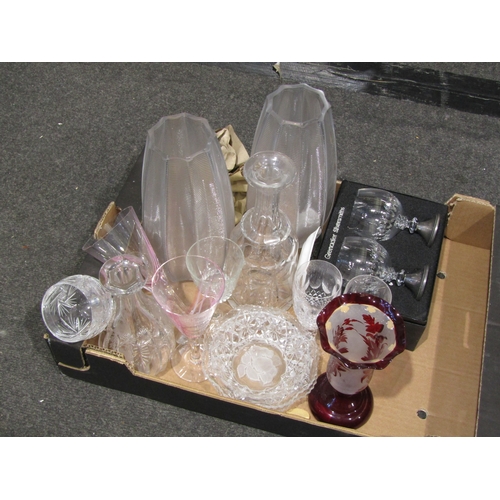 1127 - A box containing a pair of ribbed glass vases, decanters, Waterford and Caithness glasses etc.