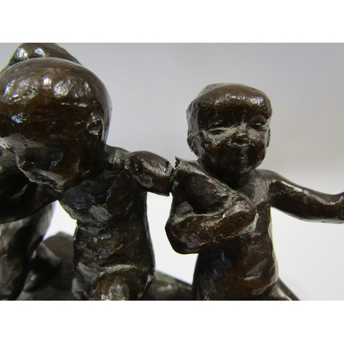 1136 - A bronze figural group of three children, granite plinth, a/f crack to arm of central figure, 14cm h... 