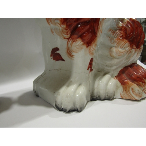 1137 - A pair of late 19th/early 20th Century Staffordshire Spaniels, one a/f, glue repair to front feet, 2... 