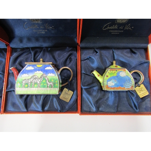 1199 - Four Charlotte Di Vita hand painted enamel miniature teapots in original boxes, all with tags and bo... 