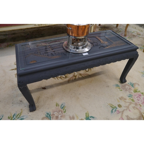 2335 - An oriental painted and carved coffee table