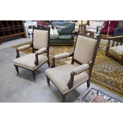 2338 - A pair of Edwardian fireside armchairs, a/f