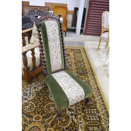 2339 - A Victorian rosewood nursing chair, barley twist supports on brass castors with green velvet upholst... 