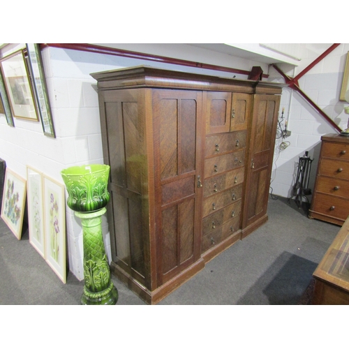 1015 - An early 20th Century compactum, two cupboard doors over six drawers flanked by two doors, 186cm tal... 