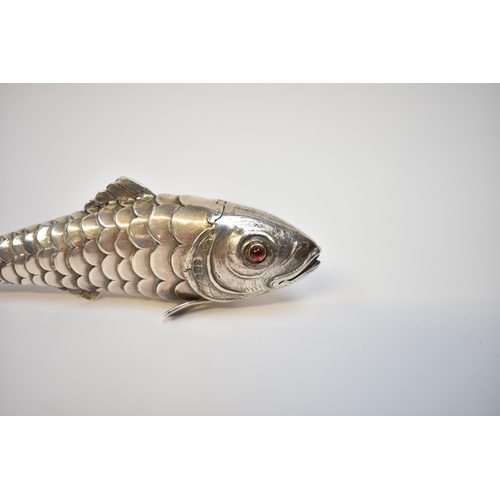 8022 - A well modelled late Victorian silver articulated fish pill box. Eighteen sectioned body with hinged... 