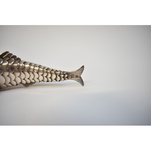 8022 - A well modelled late Victorian silver articulated fish pill box. Eighteen sectioned body with hinged... 