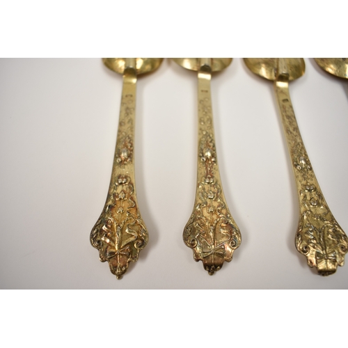 8096 - Six 19th Century Czechoslovakia silver gilt, Trefid spoons with decorative backs, 18.7cm long, 270g