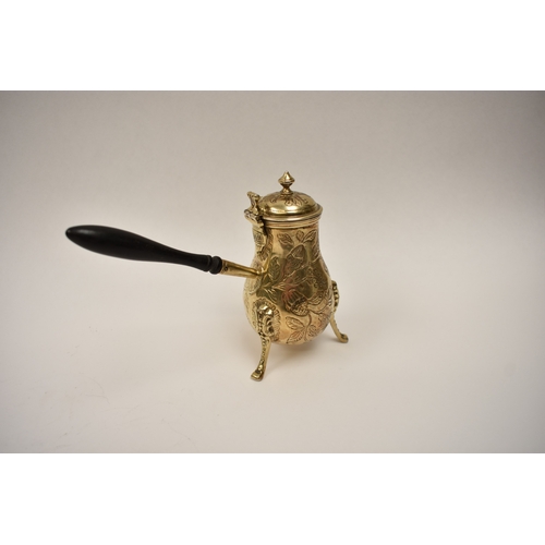 8100 - A 19th Century French silver gilt chocolate pot with ebony handle, 13cm tall, 159g