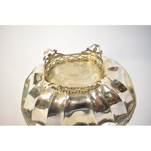 8048 - Retailed by Edward & Son Glasgow a silver bread basket with swing handle and pierced border, Birming... 