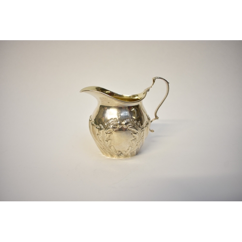 8050 - A Thomas Hayes silver cream jug with acanthus and wrythen detail, Birmingham 1893, 8.5cm tall, 68g