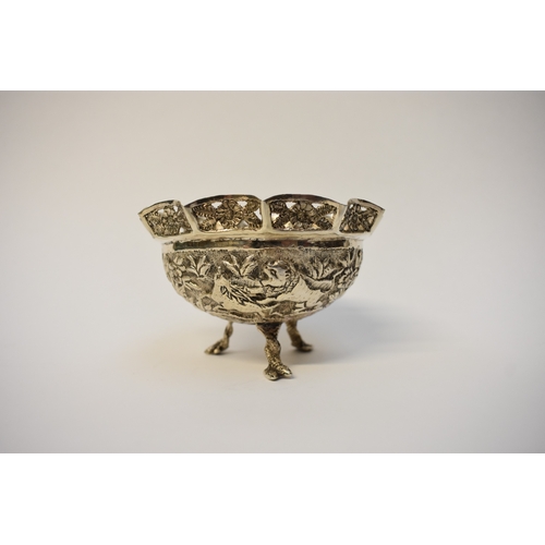 8052 - An Indian silver small bowl decoration with hunting lion, pierced border, raise on three feet, 7cm t... 