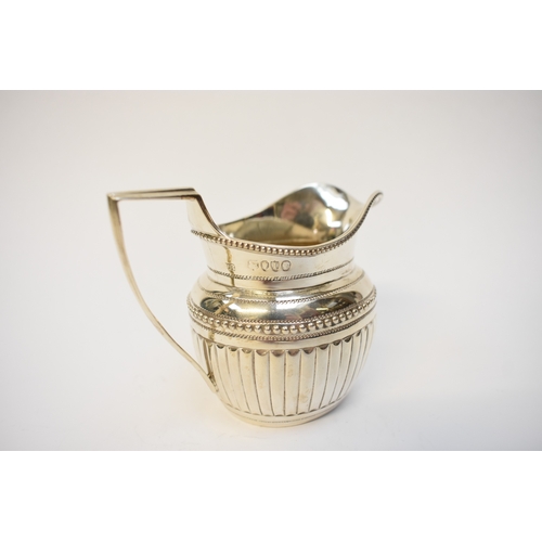 8057 - A Frederick Brasted silver cream jug with beaded edge, fluted body, London 1884, 8cm tall, 102g