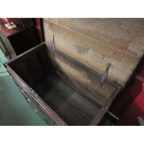 4039 - An 18th Century provincial oak chest, the hinged lid over two faux drawers and two short base drawer... 