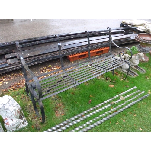 7052 - A scroll arm, strap metal three seater garden bench, 58.5