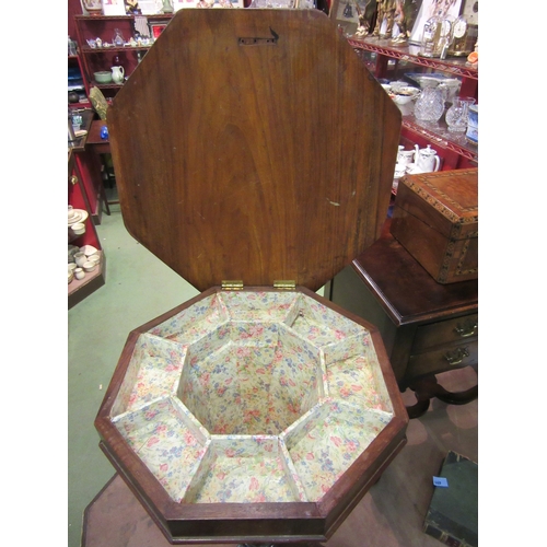 4008 - A Victorian walnut octagonal top trumpet sewing table on carved tripod legs, 73cm tall