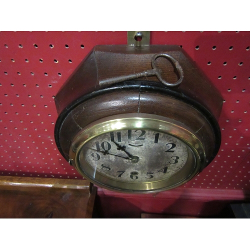 4027 - An octagonal wall clock with Waterbury balance wheel movement, circa 1910, 10