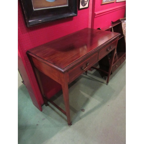 4078 - An Edwardian crossbanded mahogany side table, the two frieze drawers over square tapering legs on ce... 