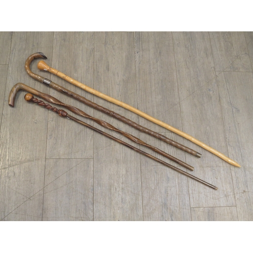 8612 - Four walking sticks/canes including walnut twist handle example