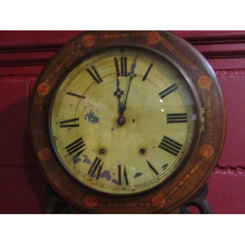 4139 - A walnut cased drop dial wall clock with inlaid design, the Roman numeral dial (a/f) surrounded by a... 