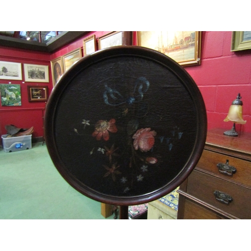 4145 - A Regency mahogany pole screen the swirl carved finial over a painted canvas circular screen on a tu... 