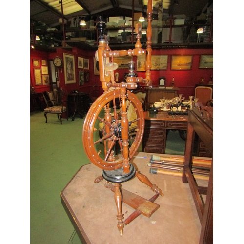 4191 - A 19th Century spinning wheel, 124cm tall