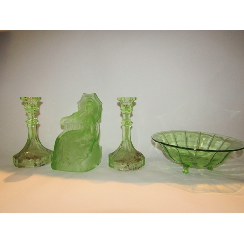 4227 - A group of uranium glassware including two candlesticks, an Art Deco vase, bowl, rose vase and a sea... 