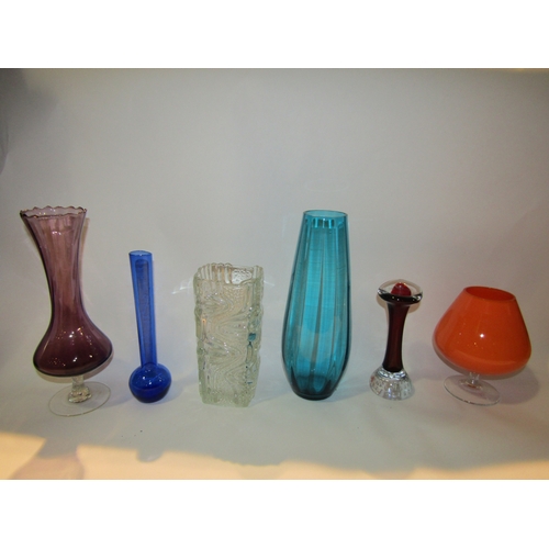 4228 - A group of retro mid Century glassware including a set of six Italian glasses, coloured glass vases ... 