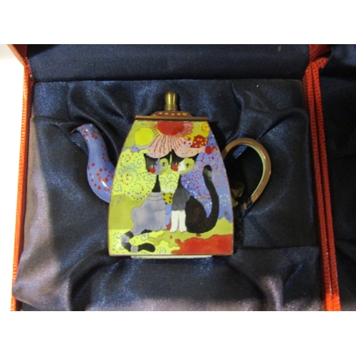 4229 - Three hand painted enamel Charlotte Di Vita miniature teapots in the style of Rosina Wachtmeister de... 