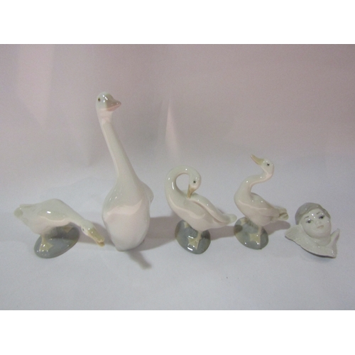 4235 - Four Lladro geese together with a Lladro angel wall hanging