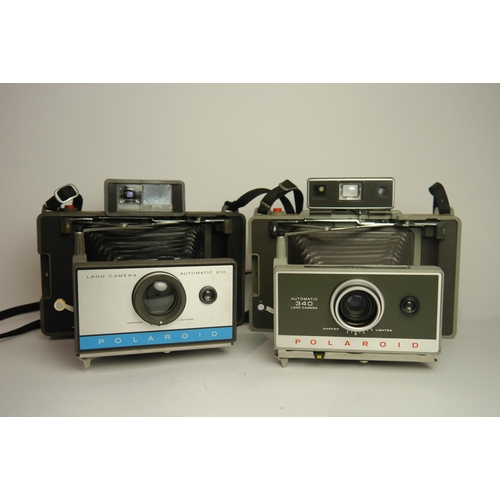 6096 - Two Polaroid Instant Cameras Models 340 & 210. 

Both Cased

**Untested**