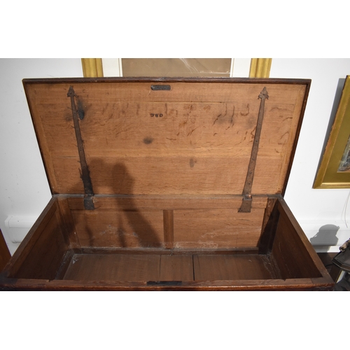 8488 - A late 17th/18th Century oak coffer on cupboard base with drawers to the interior, geometric moulded... 