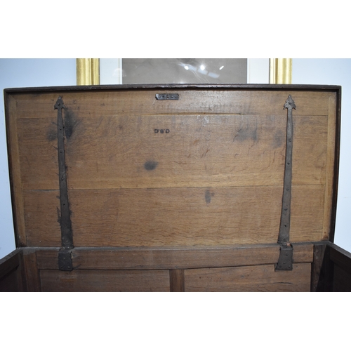 8488 - A late 17th/18th Century oak coffer on cupboard base with drawers to the interior, geometric moulded... 