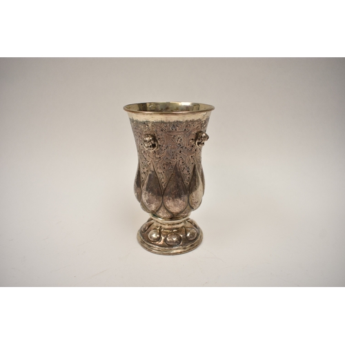 8070 - A German silver highly ornate silver cup/chalice with domed footed base cherub head embellishment 12... 