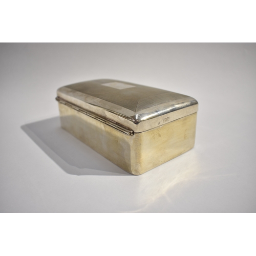 8098 - A Charles Stuart Harris silver cigarette box with engine turned detail, vacant cartouche. Lined wood... 