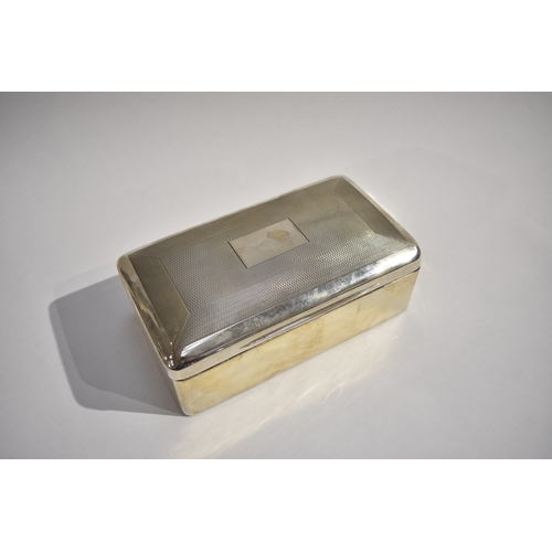 8098 - A Charles Stuart Harris silver cigarette box with engine turned detail, vacant cartouche. Lined wood... 