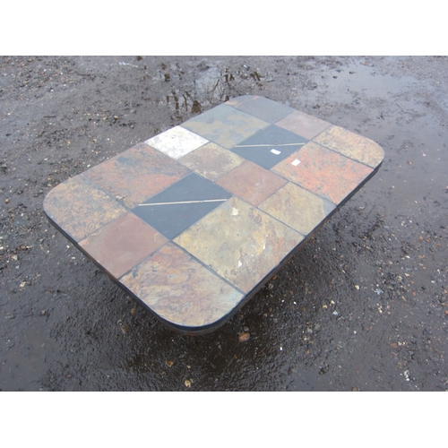 3336 - A tiled stone coffee table, 121.5cm long