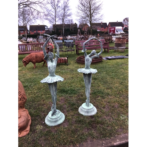 7456 - A pair of verdigris cast iron garden ballerinas, 123cm tall