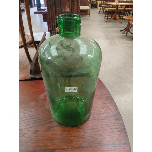 2402 - A hand blown green glass jar