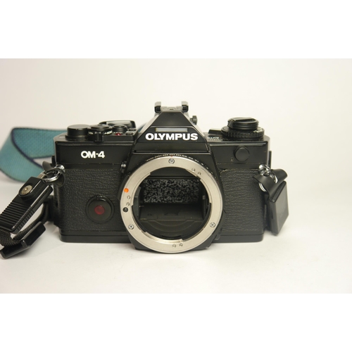 6038 - A Cased Olympus OM-4 (black) w/ Olympus Om-System Zuiko Auto-S 50mm f1.8 & Auto-W 28mm f2.8. Include... 