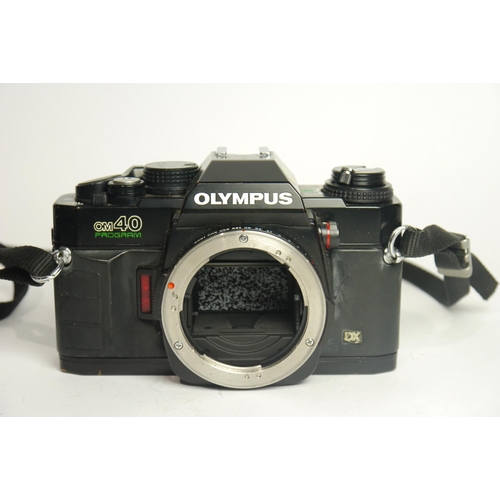 6041 - A Cased Olympus OM-1 & OM40 w/ Two Olympus Om-System Zuiko Auto-S 50mm F1.8 lenses & A Olympus OM-Sy... 