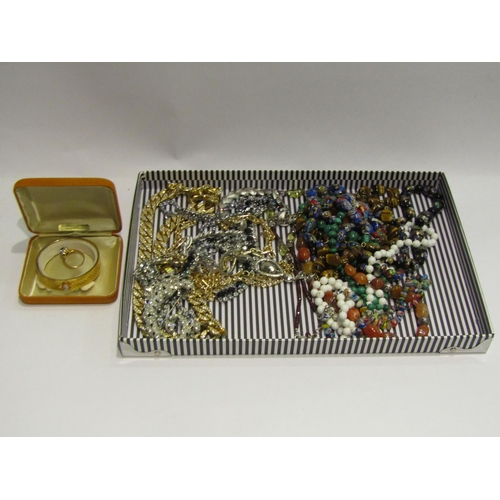 4395 - A box of necklaces to include malachite, tigers eye and millefiori together with a gold plated stiff... 