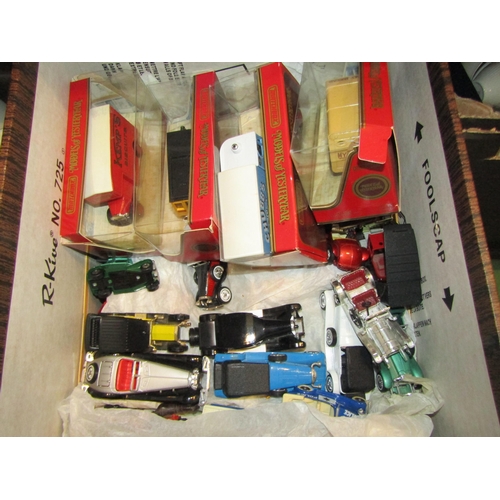 4397 - A box of diecast cars to include four boxed Models of Yesteryear and various Matchbox examples