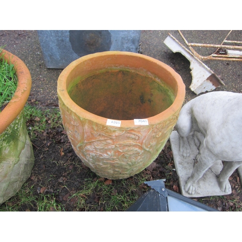 7041 - A terracotta foliate planter, 44cm tall, 44cm diameter at top