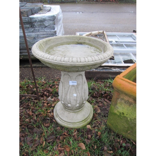 7050 - A decorative composition birdbath, 49cm tall