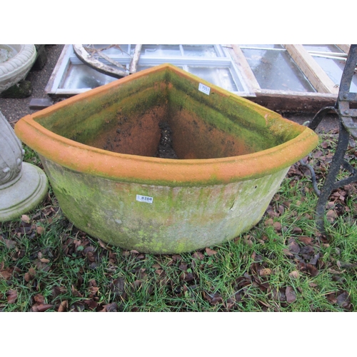 7051 - A terracotta wedge shaped planter, 40cm tall