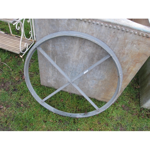 7088 - A circular metal window frame, 75cm diameter